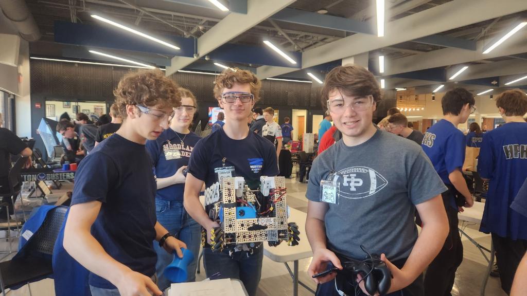 Posed picture with the robot and drive team